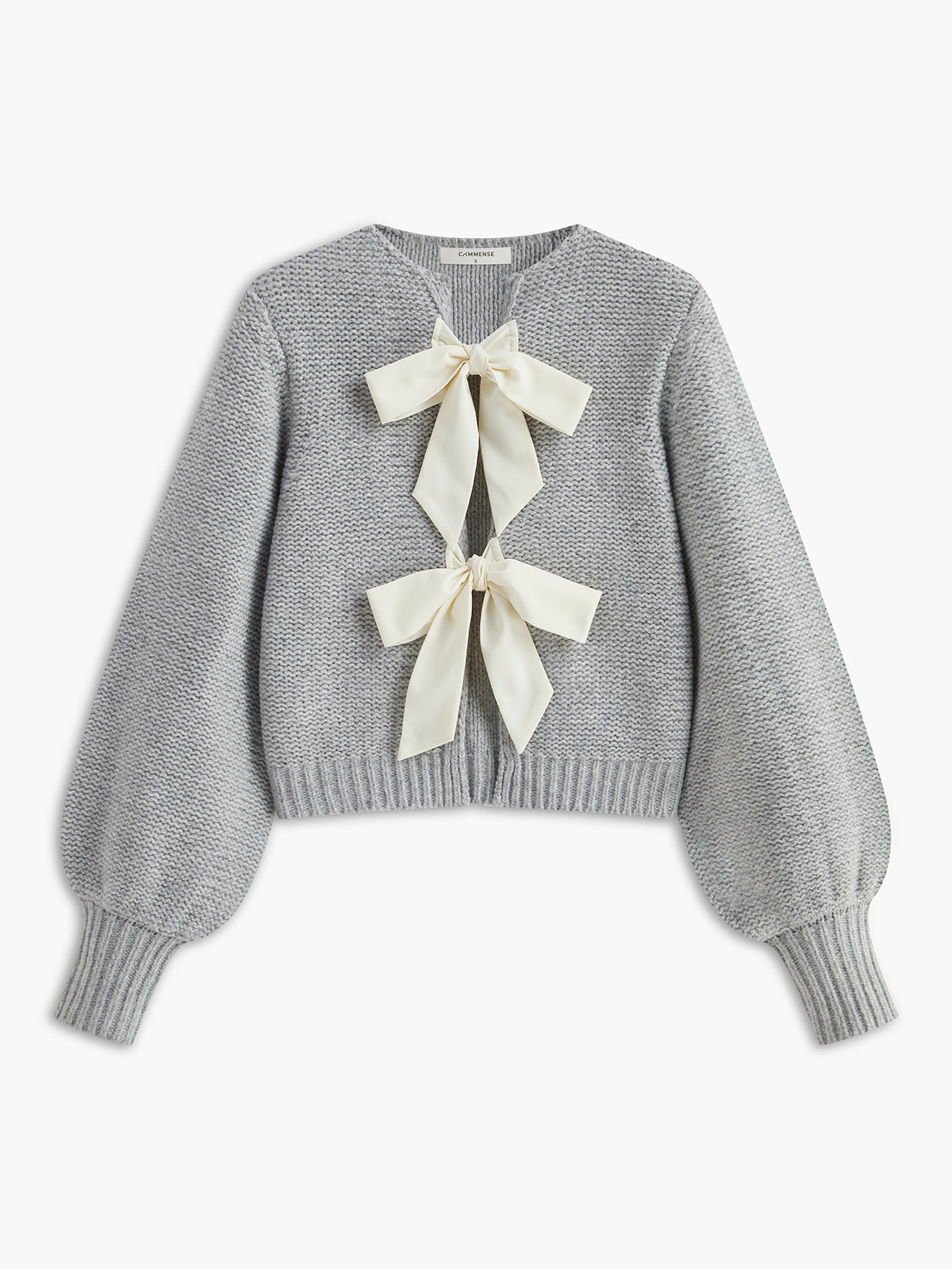 Women's knit top with bow accent and structured silhouette