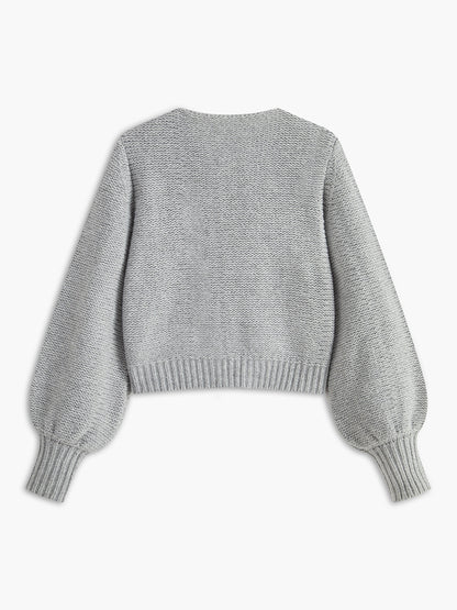 Women's knit top with bow accent and structured silhouette