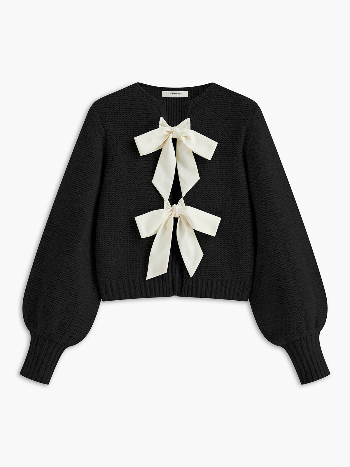 Women's knit top with bow accent and structured silhouette