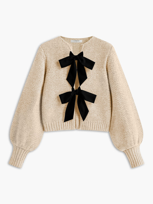 Women's knit top with bow accent and structured silhouette