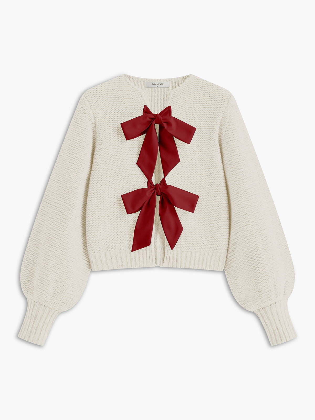 Women's knit top with bow accent and structured silhouette