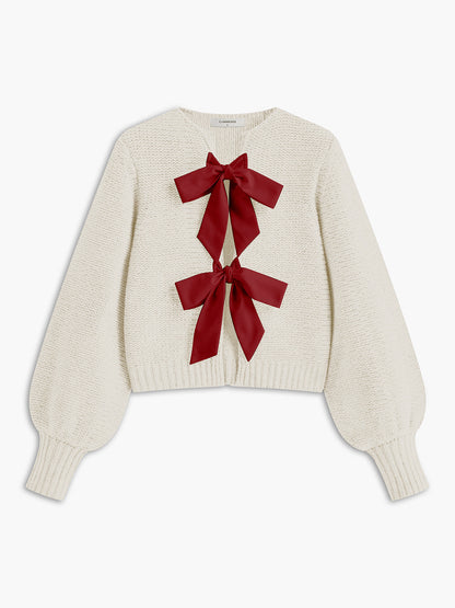 Women's knit top with bow accent and structured silhouette