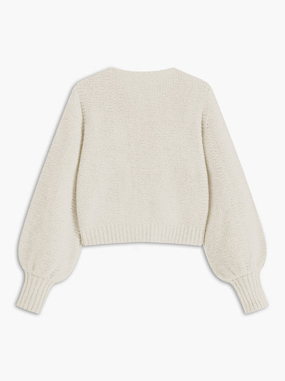 Women's knit top with bow accent and structured silhouette
