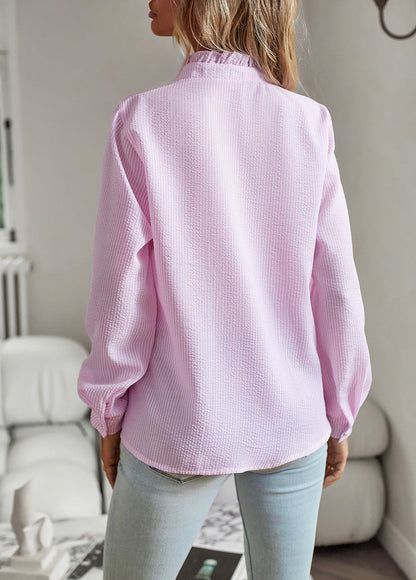 Women's blouse with ruffle accents and clean button front